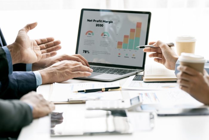 Businessman advisor, two business people talking, planning analy Businessman advisor, two business people talking, planning analyze investment and marketing on tablet in office.